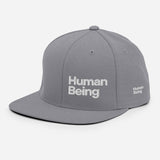 HUMAN BEING Snapback Hat